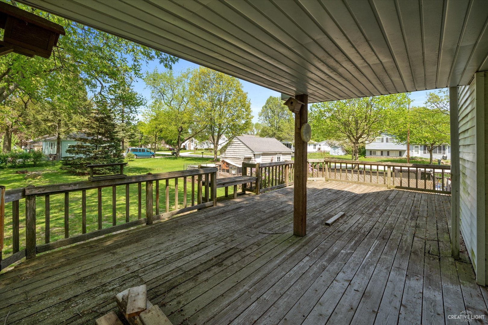 28W678 Warrenville Road Warrenville, IL 60555 - Photo 19 of 21 a porch with wooden floor in outdoor space