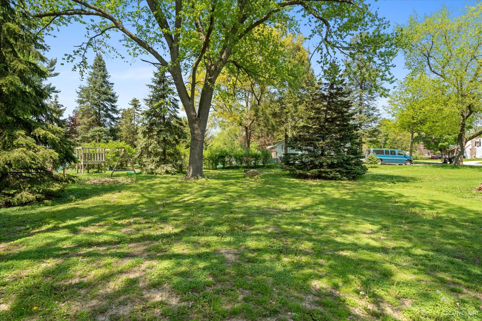 28W678 Warrenville Road Warrenville, IL 60555 - Photo 20 of 21 a view of outdoor space with trees all around