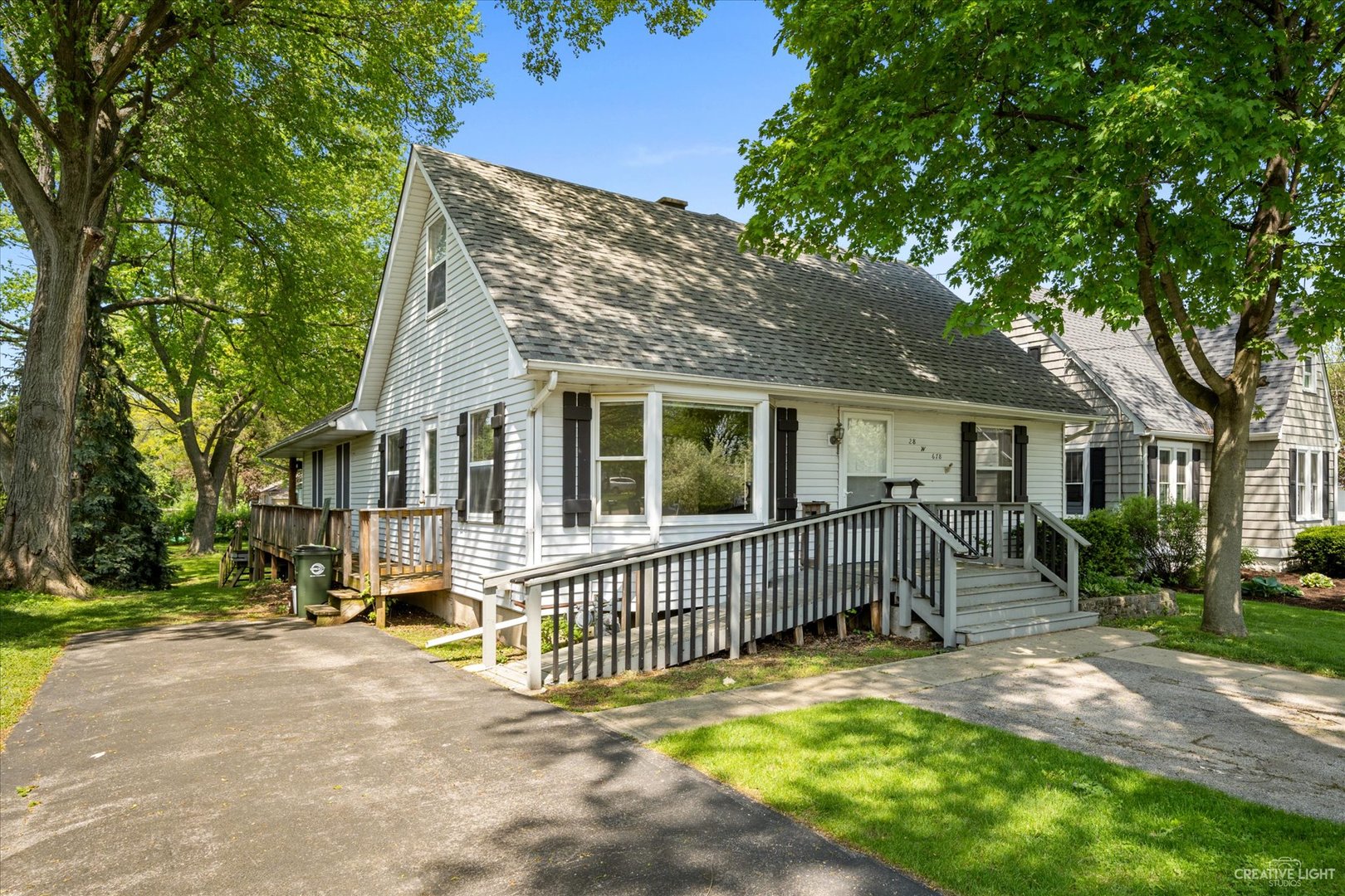 28W678 Warrenville Road Warrenville, IL 60555 - Photo 2 of 21 a view of a house with a yard