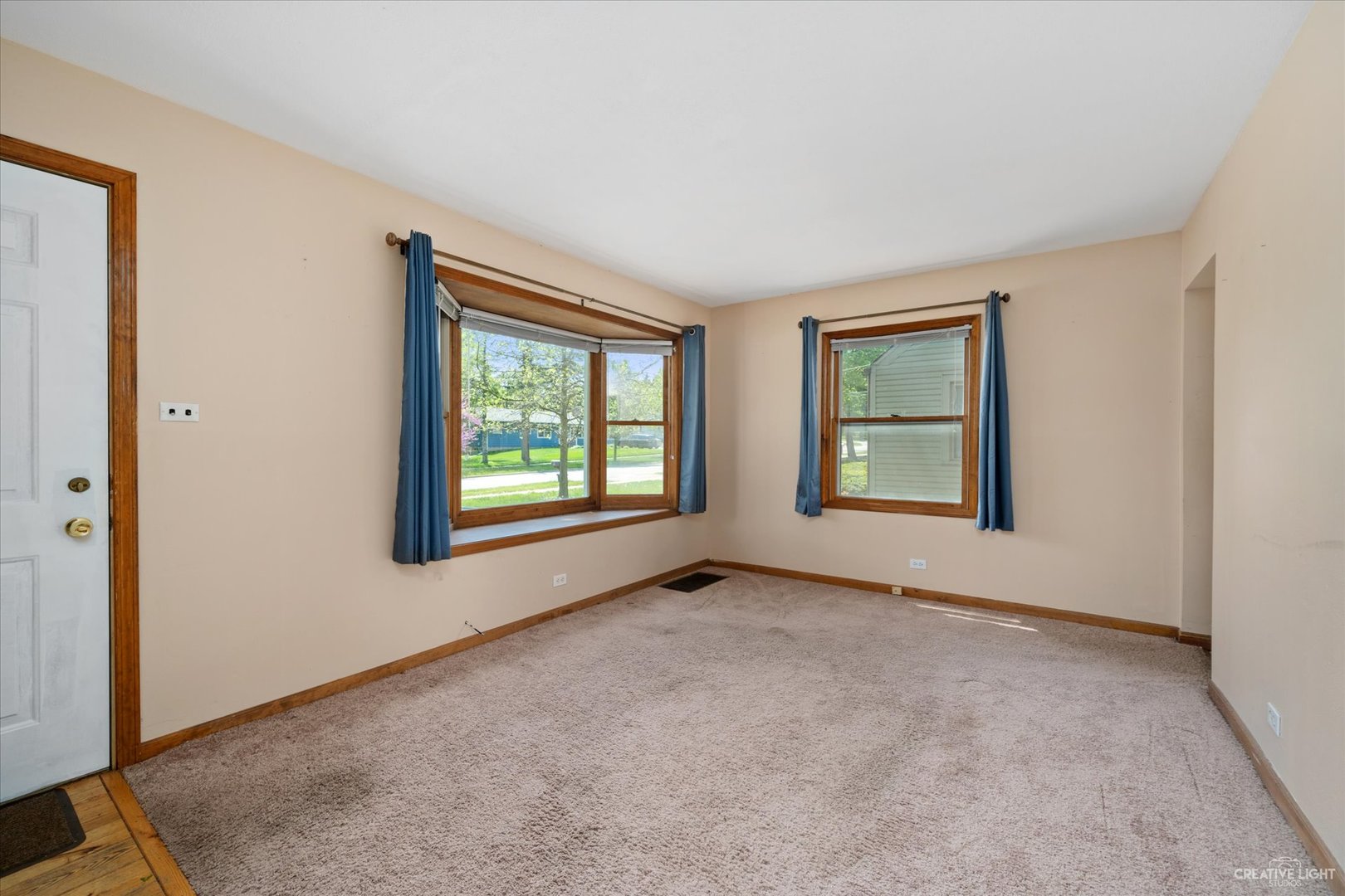28W678 Warrenville Road Warrenville, IL 60555 - Photo 3 of 21 an empty room with windows