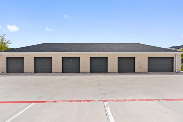 a garden with trees in front of it