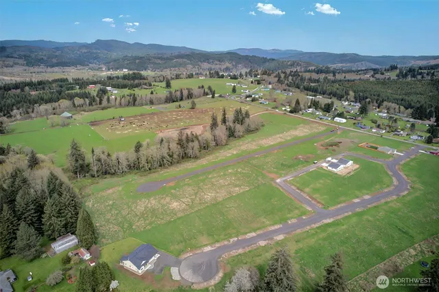 a view of a golf course with an ocean