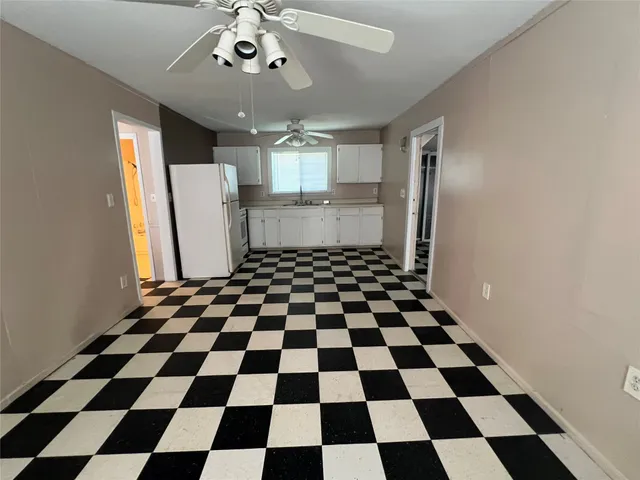 a black and white checkered floor with a black white checkered floor