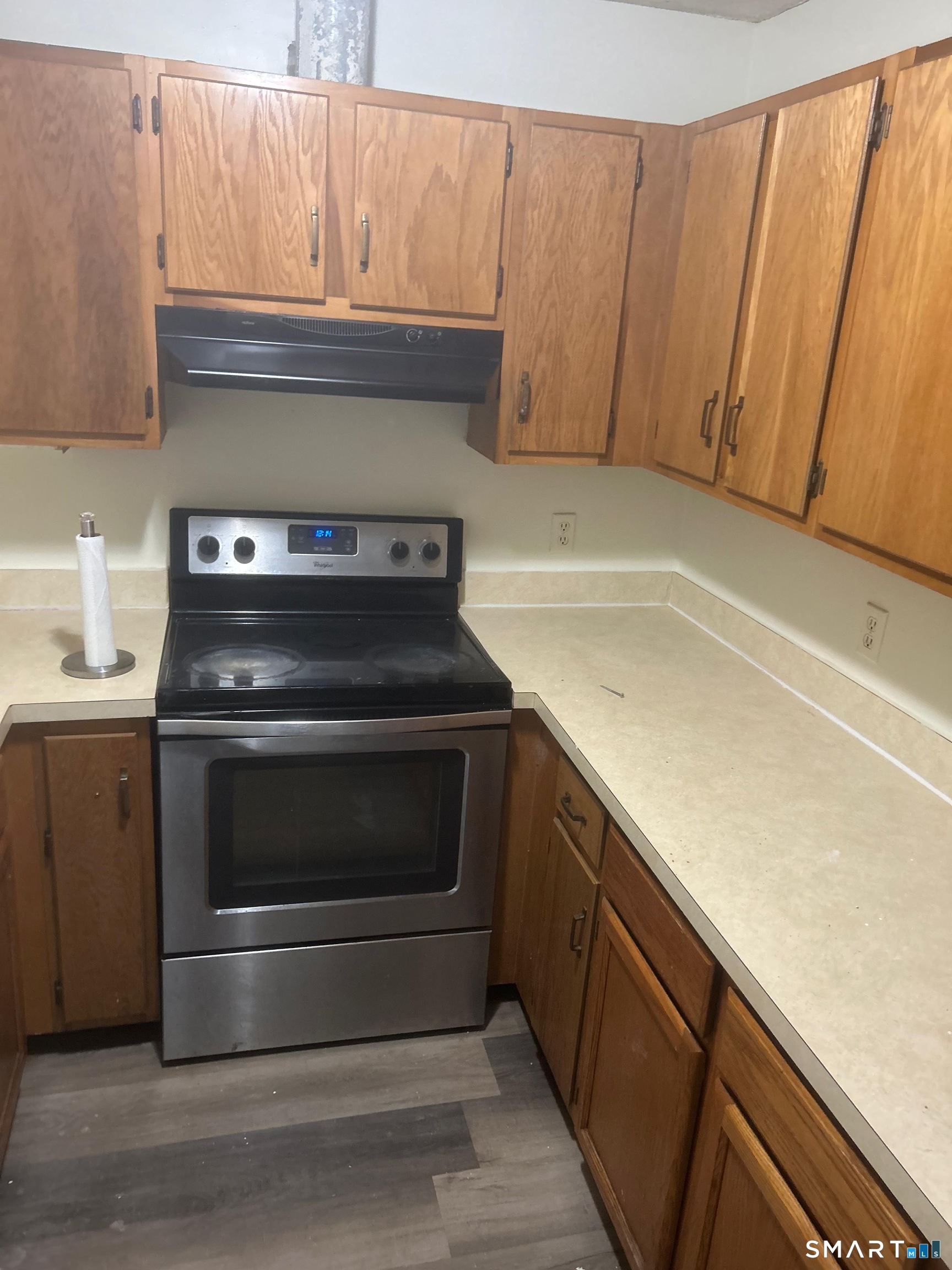 a kitchen with a stove and a sink