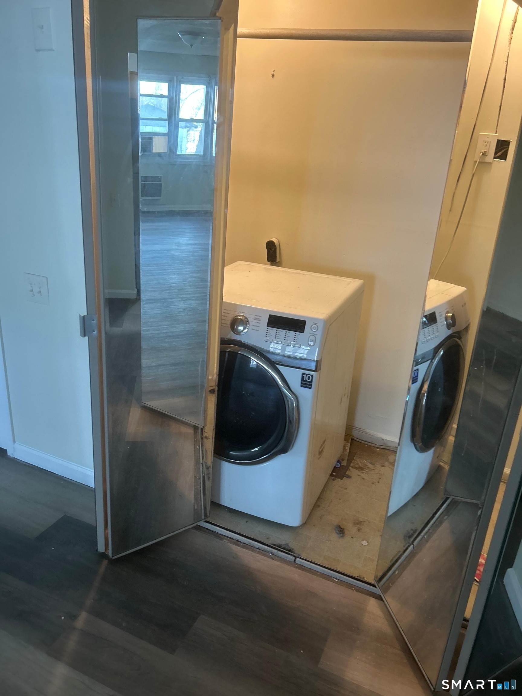 30 Stevens Street, Unit 105 Bridgeport, CT 06606 - Photo 4 of 8 a utility room with a washer and dryer