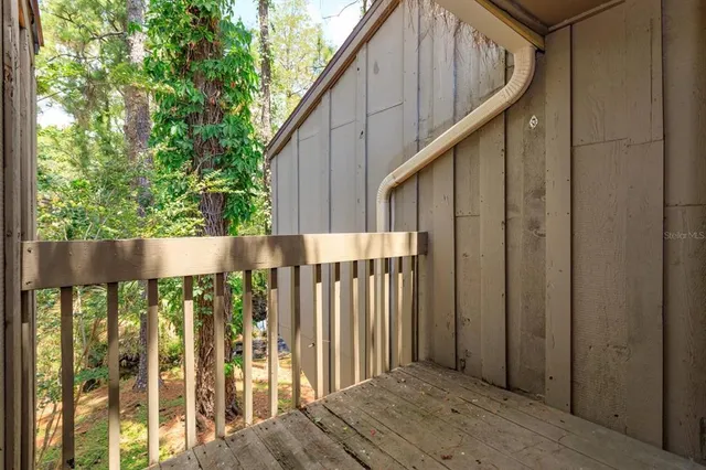 a wooden fence with trees in the background