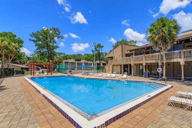 a view of a swimming pool with a patio