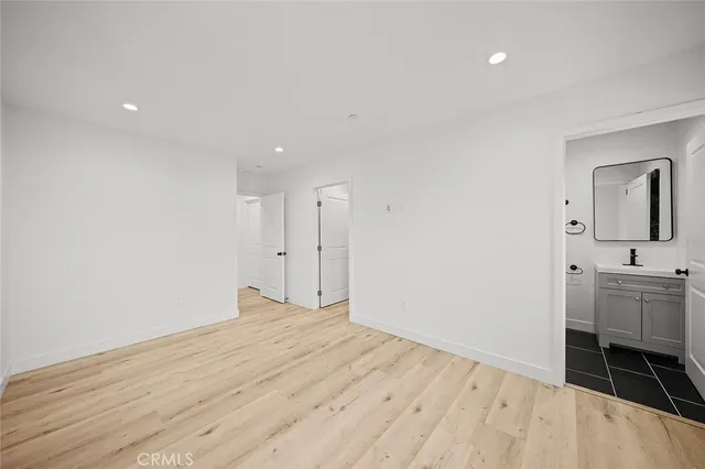 a room with a bed and bathroom