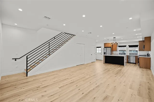 a view of kitchen with cabinets and wooden floor