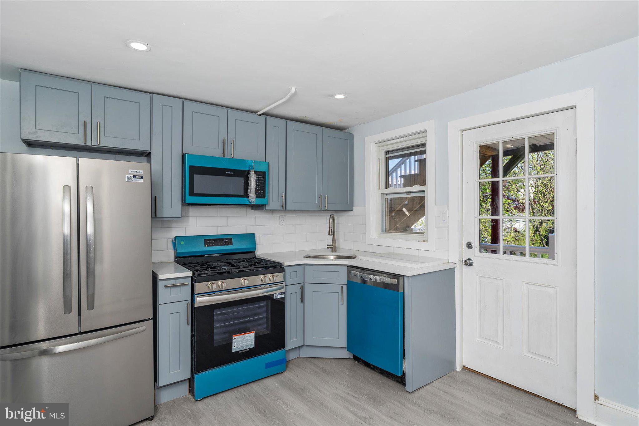 10 Lytle Street, Unit 4 Princeton, NJ 08542 - Photo 6 of 17 a kitchen with a sink stove and refrigerator