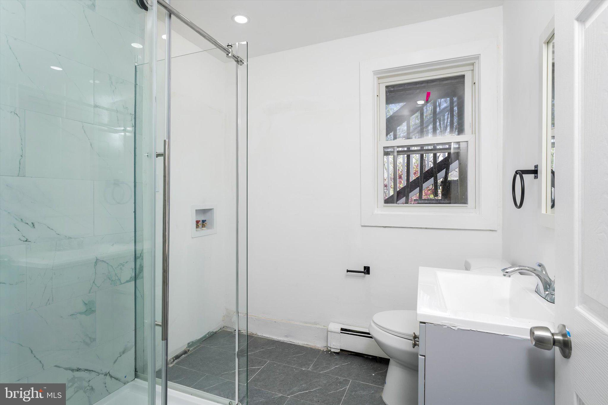 10 Lytle Street, Unit 4 Princeton, NJ 08542 - Photo 8 of 17 a bathroom with a toilet sink and shower