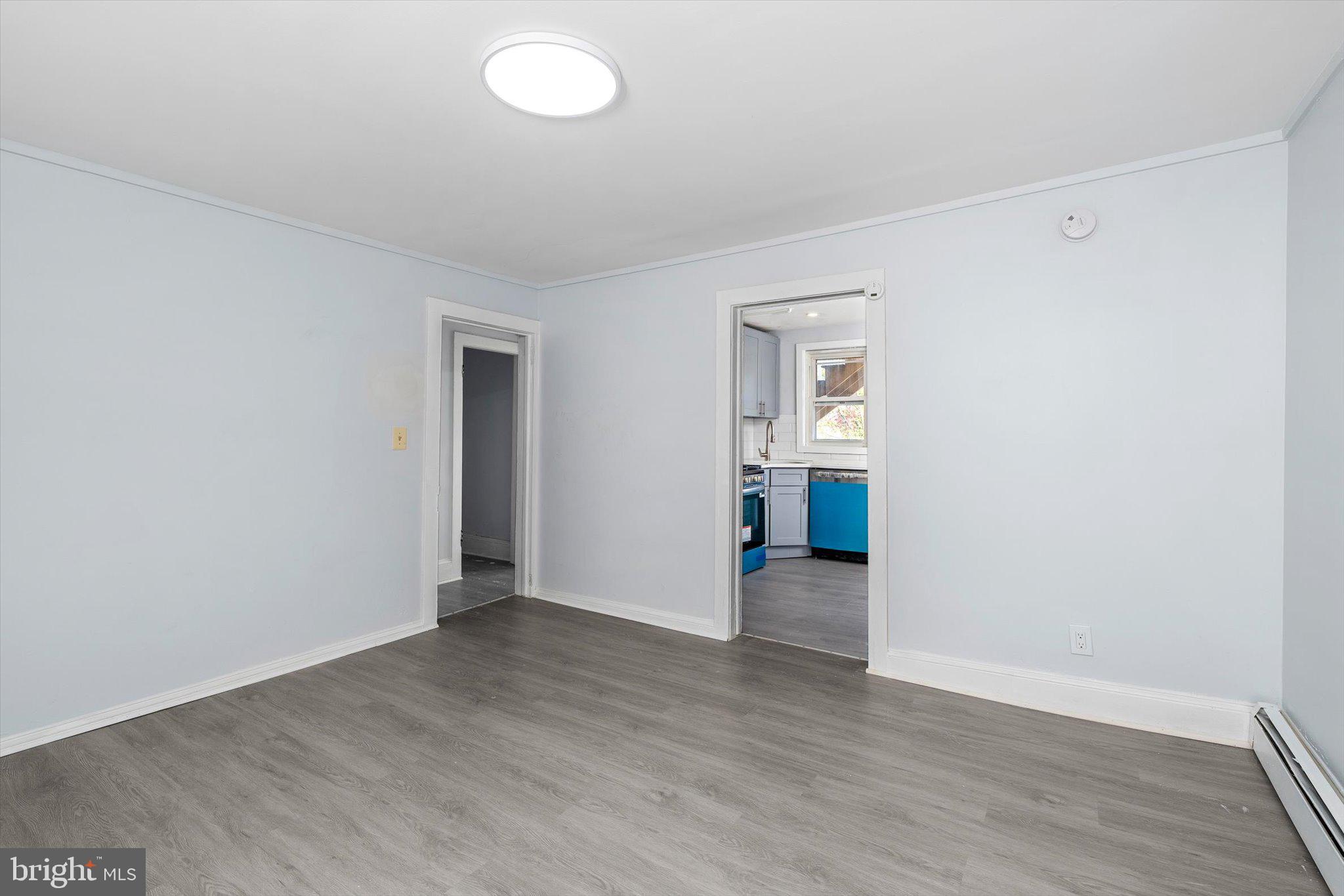 10 Lytle Street, Unit 4 Princeton, NJ 08542 - Photo 10 of 17 an empty room with wooden floor and windows