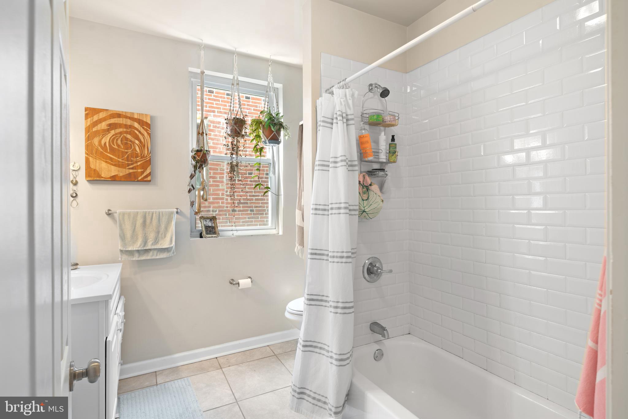 4804 Kingsessing Avenue Philadelphia, PA 19143 - Photo 14 of 17 a bathroom with a bathtub and a shower