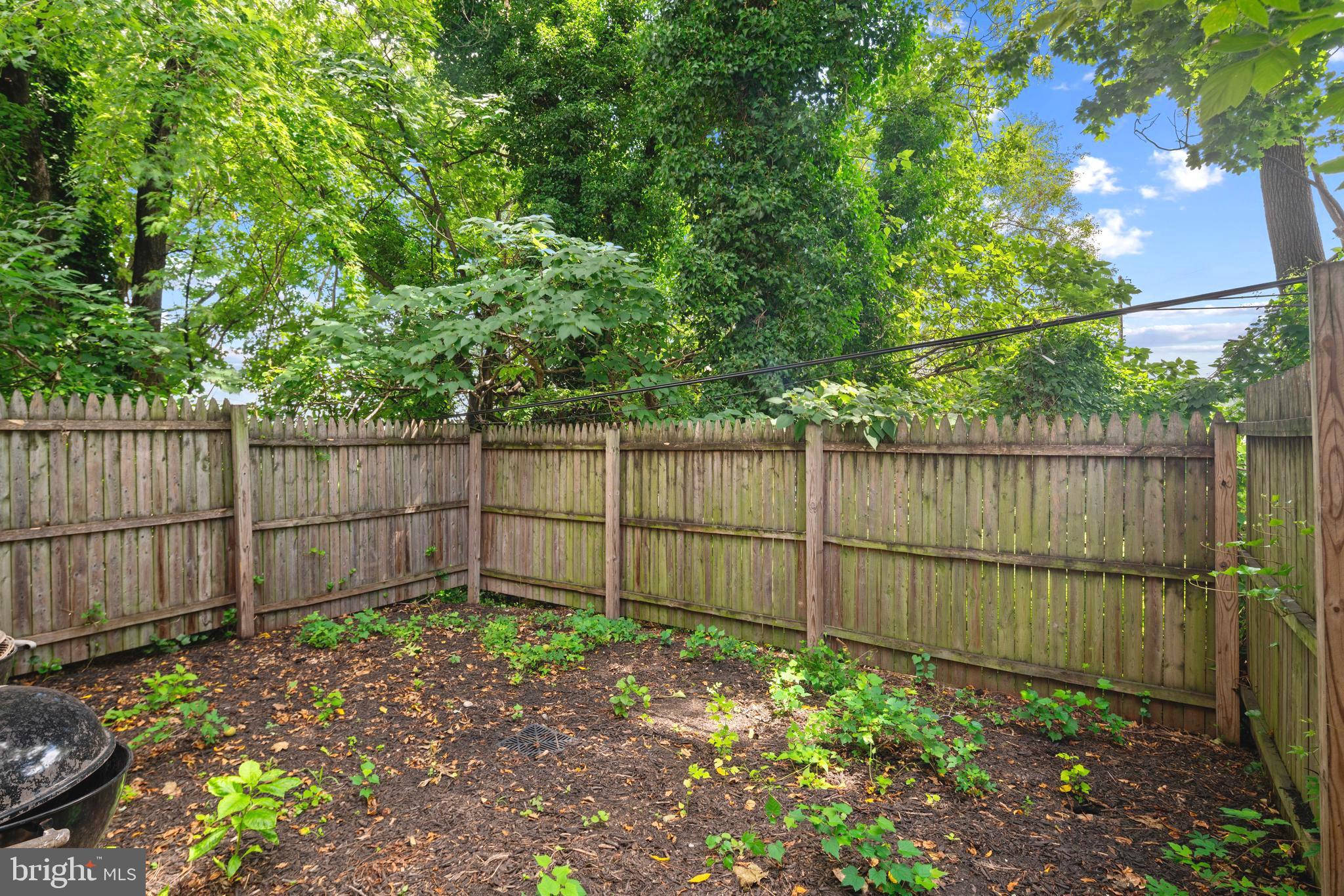 4804 Kingsessing Avenue Philadelphia, PA 19143 - Photo 17 of 17 a garden view with a fence