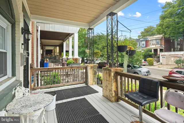 a view of a balcony with wooden floor