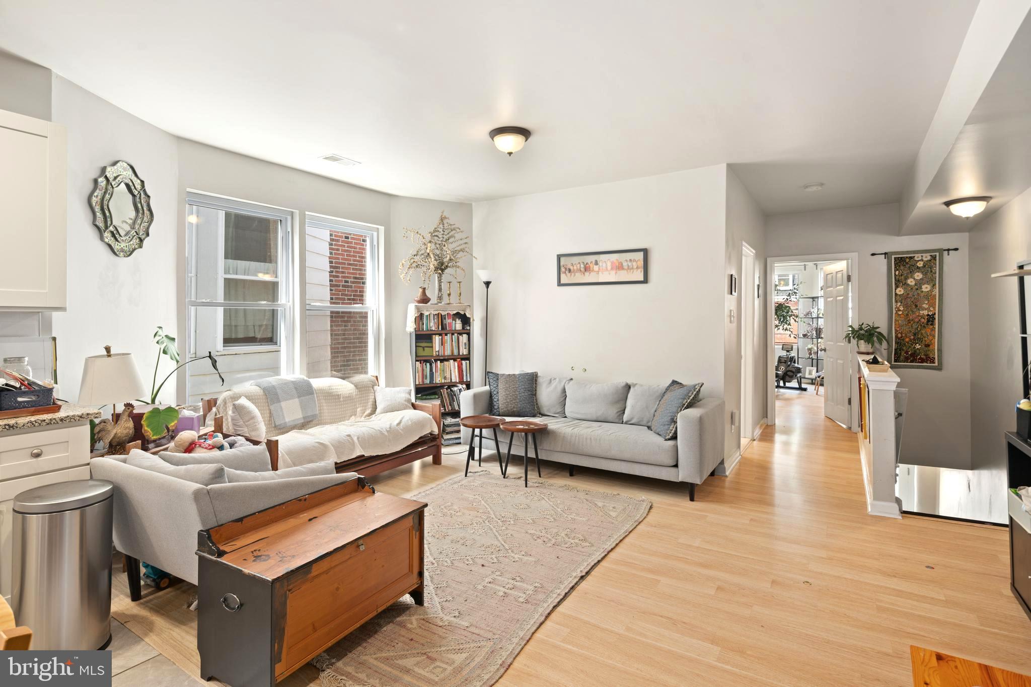 4804 Kingsessing Avenue Philadelphia, PA 19143 - Photo 8 of 17 a living room with furniture and a large window