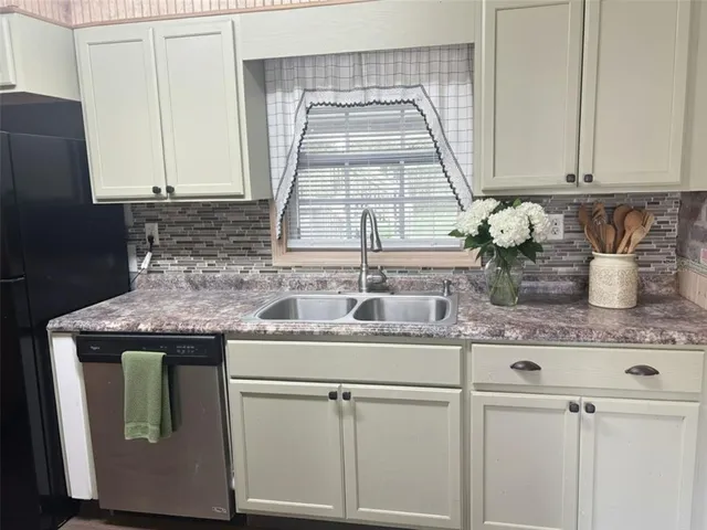 a kitchen with a sink and cabinets