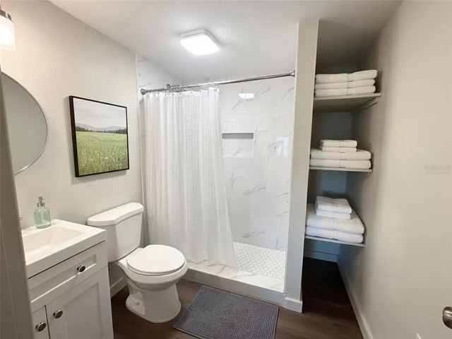a bathroom with a toilet a sink and bathtub