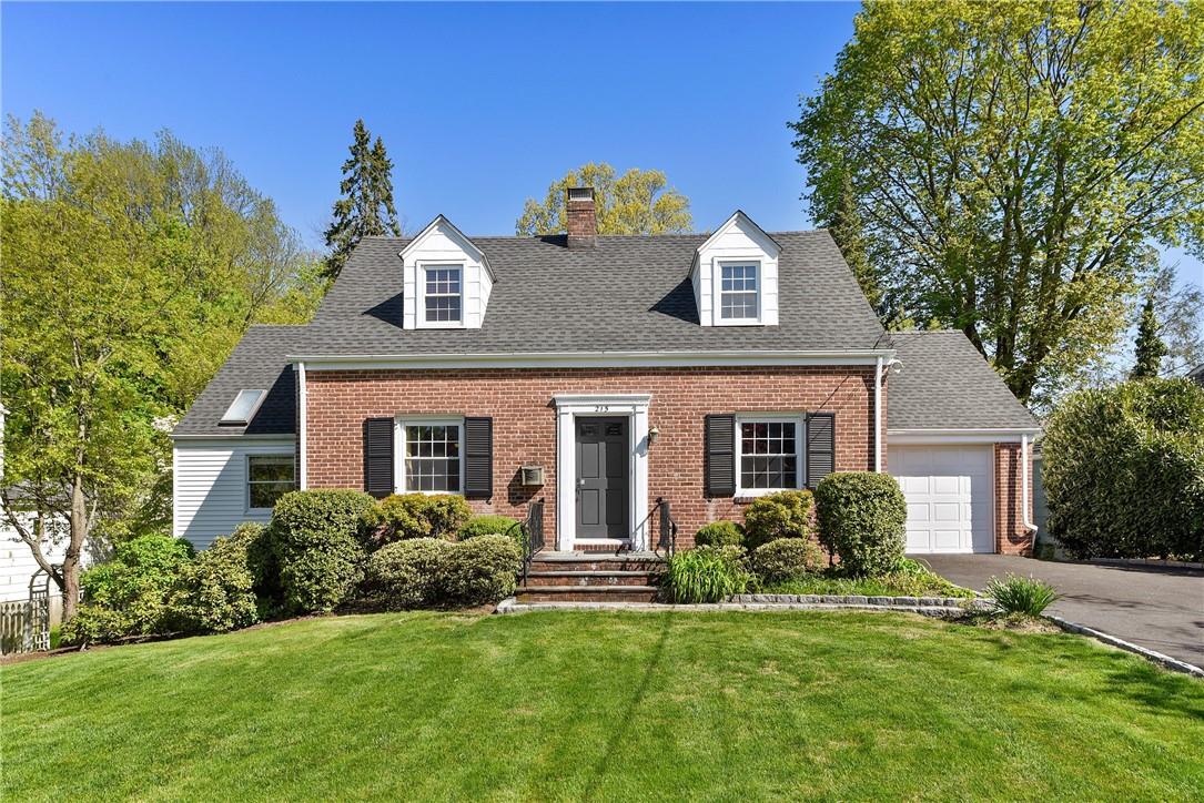 215 Betsy Brown Road Rye Brook, NY 10573 - Photo 1 of 1 a front view of house with yard and green space