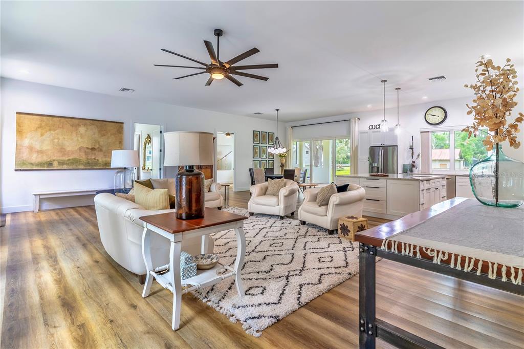 31035 Pasco Road San Antonio, FL 33576 - Photo 12 of 80 a living room with fireplace furniture and a wooden floor