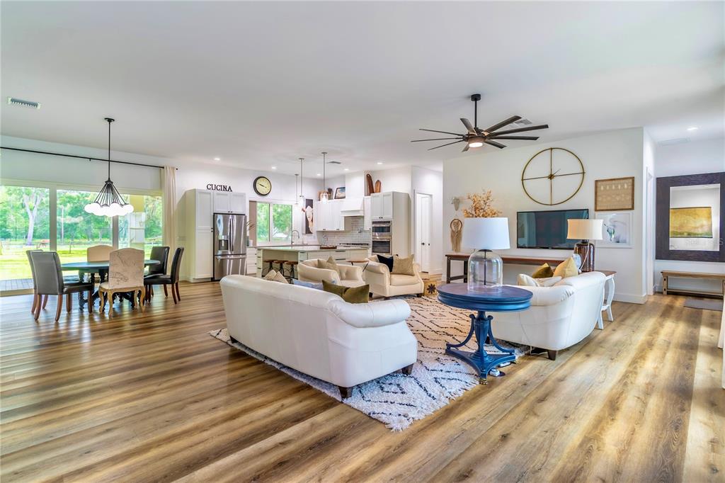 31035 Pasco Road San Antonio, FL 33576 - Photo 13 of 80 a living room with fireplace furniture and a large window