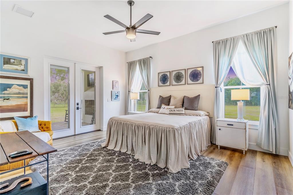 31035 Pasco Road San Antonio, FL 33576 - Photo 24 of 80 a bedroom with a bed and wooden floor