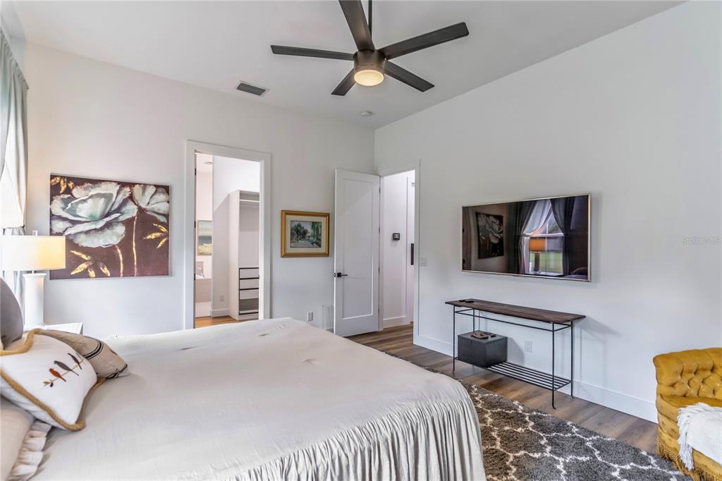 31035 Pasco Road San Antonio, FL 33576 - Photo 25 of 80 a bedroom with a bed and a tv