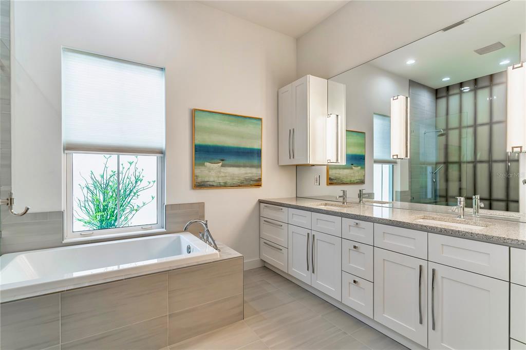 31035 Pasco Road San Antonio, FL 33576 - Photo 28 of 80 a bathroom with a large tub sink and window