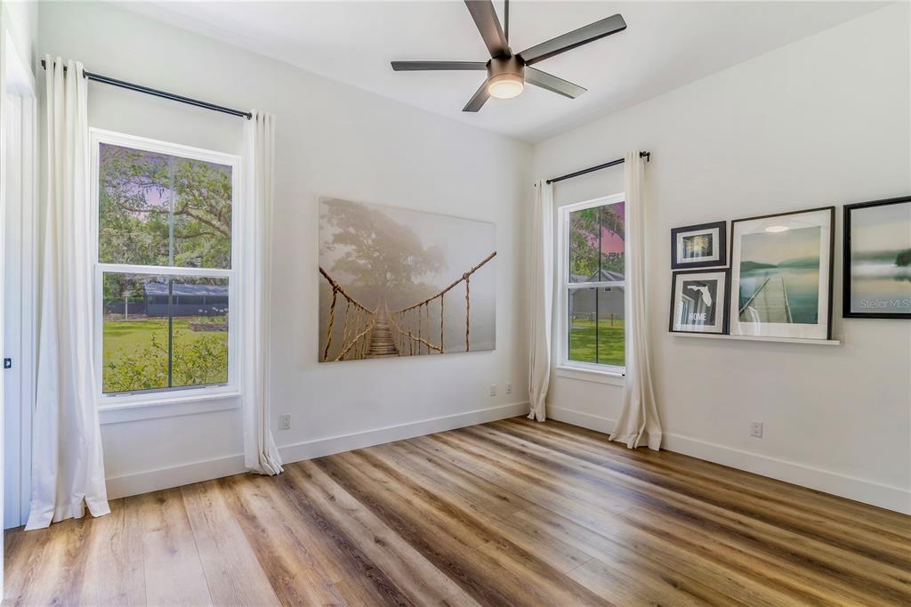 31035 Pasco Road San Antonio, FL 33576 - Photo 32 of 80 wooden floor in an empty room with a window