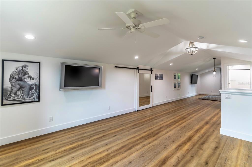 31035 Pasco Road San Antonio, FL 33576 - Photo 45 of 80 a view of a livingroom with a flat screen tv