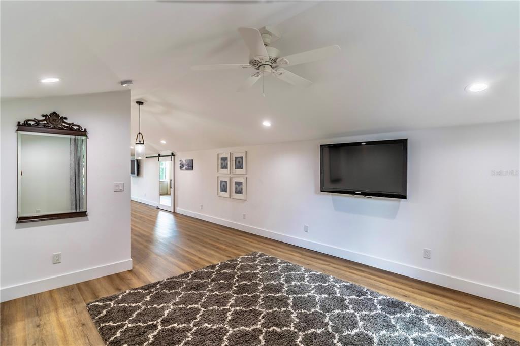 31035 Pasco Road San Antonio, FL 33576 - Photo 48 of 80 wooden floor in an empty room with a window