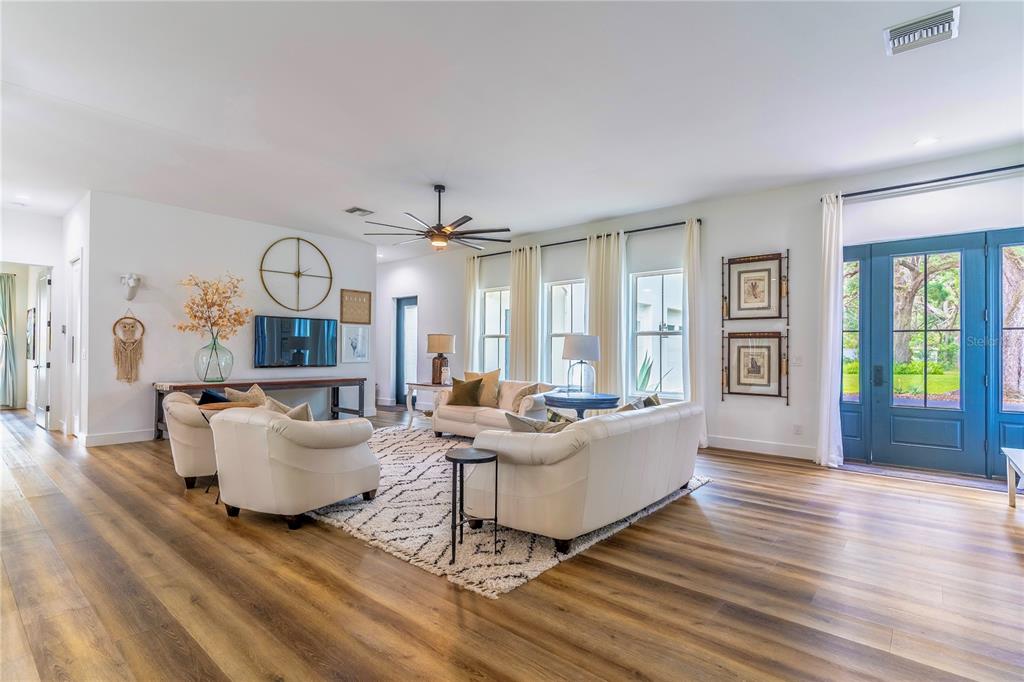 31035 Pasco Road San Antonio, FL 33576 - Photo 5 of 80 a living room with fireplace furniture and a large window