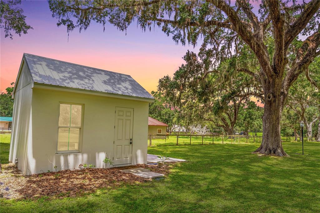 31035 Pasco Road San Antonio, FL 33576 - Photo 68 of 80 a view of a house with a yard