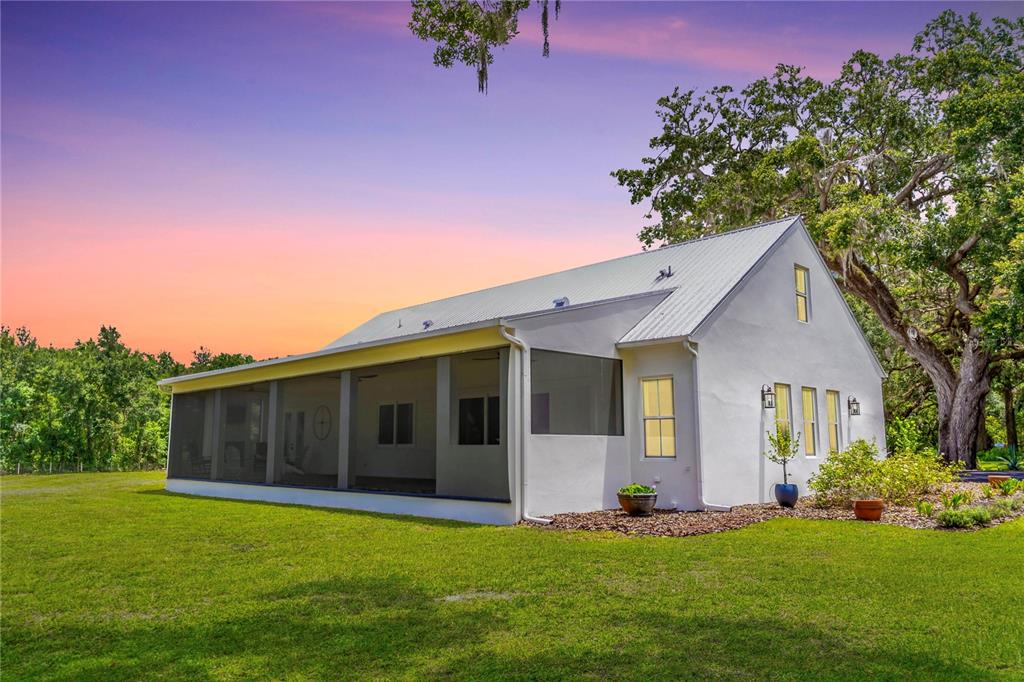 31035 Pasco Road San Antonio, FL 33576 - Photo 73 of 80 a front view of a house with a garden and yard