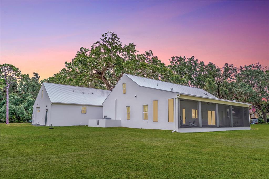 31035 Pasco Road San Antonio, FL 33576 - Photo 76 of 80 a view of a house with backyard and garden