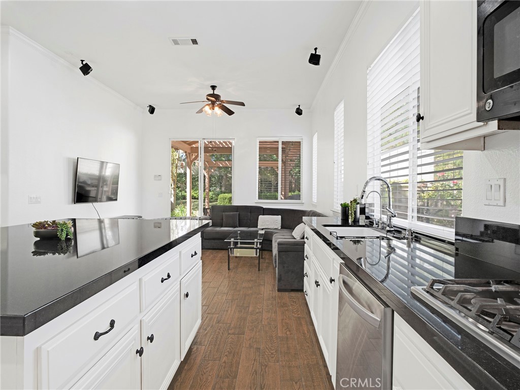 21103 Cross Creek Drive Saugus, CA 91350 - Photo 15 of 41 a kitchen with sink stove and cabinets