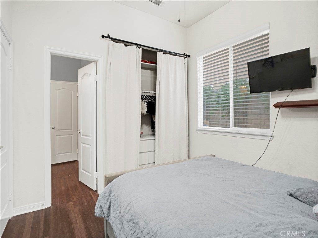 21103 Cross Creek Drive Saugus, CA 91350 - Photo 16 of 41 a bedroom with a bed and a flat screen tv