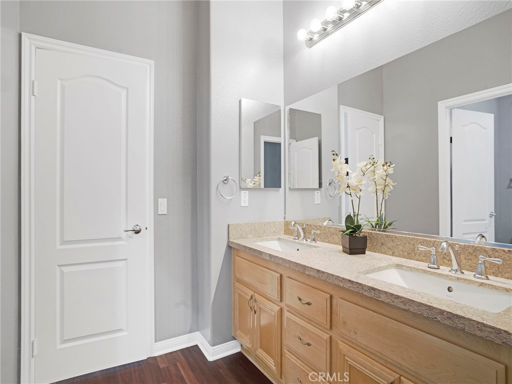 21103 Cross Creek Drive Saugus, CA 91350 - Photo 17 of 41 a bathroom with double sink and a mirror