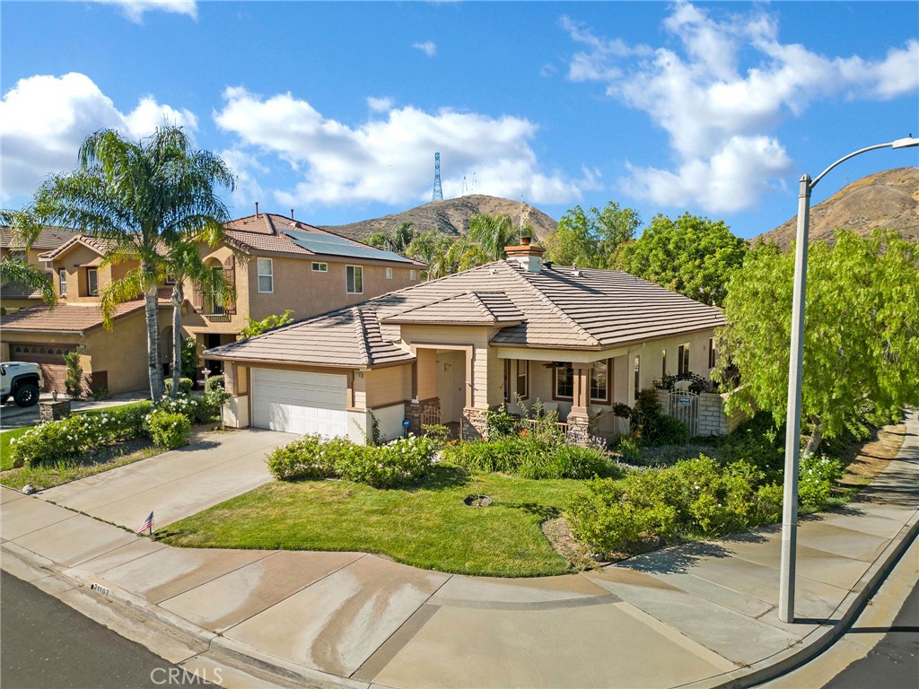 21103 Cross Creek Drive Saugus, CA 91350 - Photo 2 of 41 a view of a white house with a big yard and potted plants