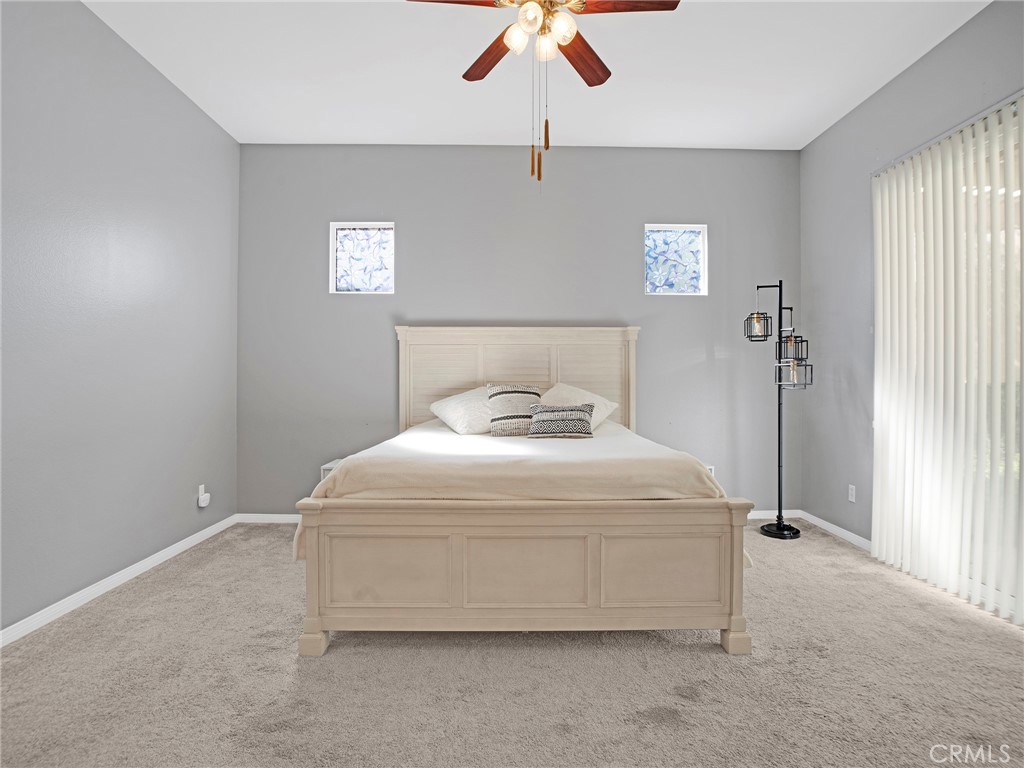 21103 Cross Creek Drive Saugus, CA 91350 - Photo 21 of 41 a bedroom with a bed and a chandelier