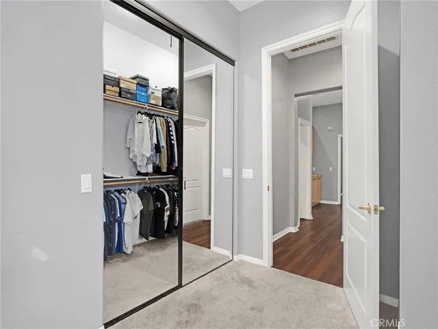 a spacious bathroom with a tub sink and mirror