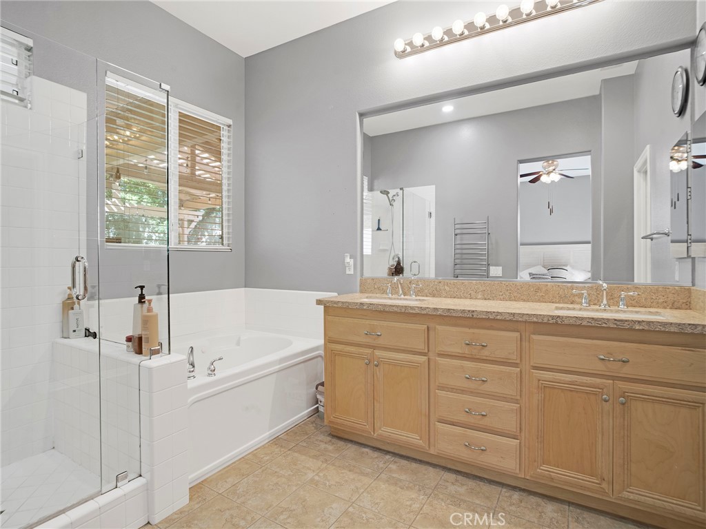 21103 Cross Creek Drive Saugus, CA 91350 - Photo 24 of 41 a spacious bathroom with a tub sink and mirror