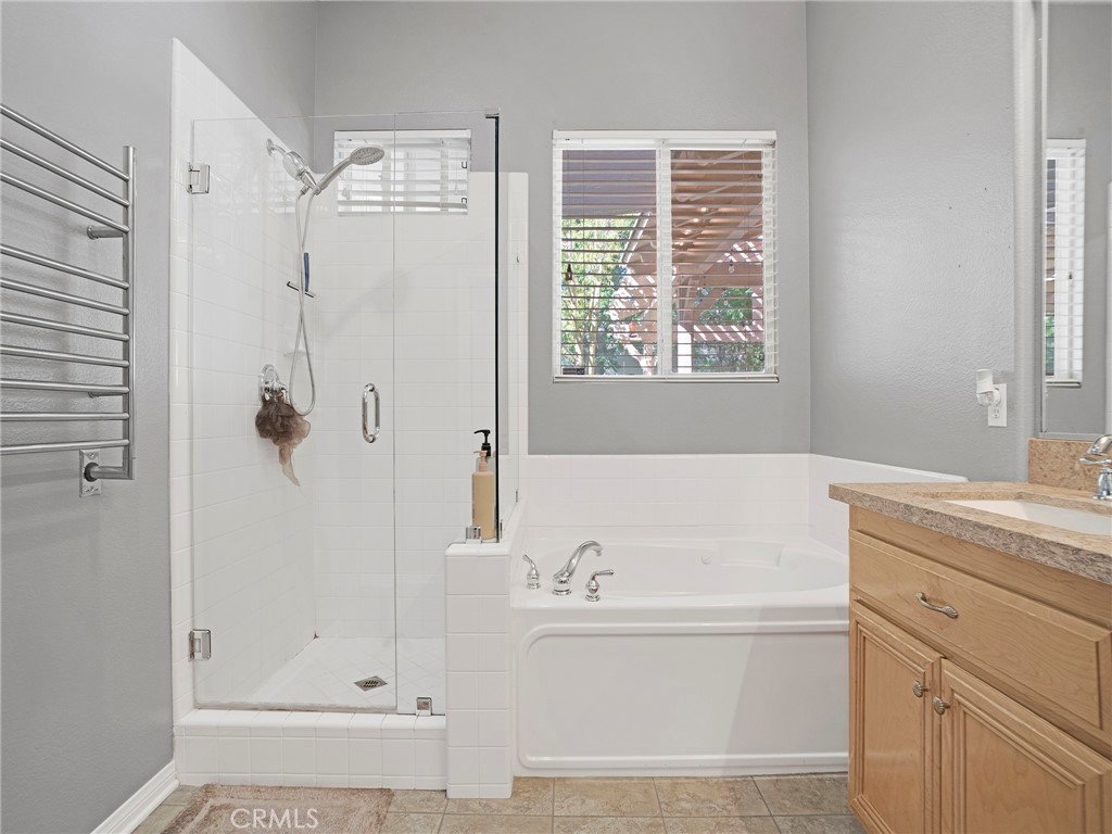 21103 Cross Creek Drive Saugus, CA 91350 - Photo 25 of 41 a bathroom with a bathtub and a shower