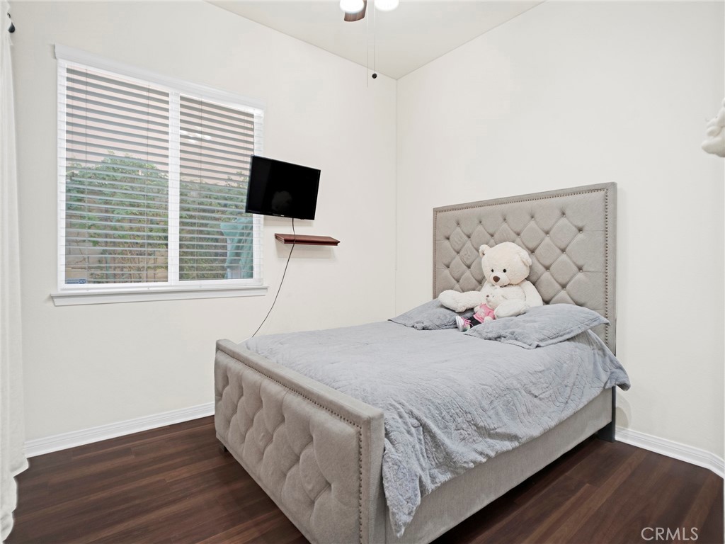 21103 Cross Creek Drive Saugus, CA 91350 - Photo 26 of 41 a bedroom with a bed and a flat screen tv