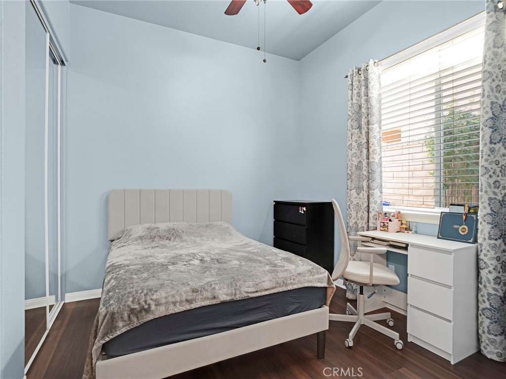 21103 Cross Creek Drive Saugus, CA 91350 - Photo 27 of 41 a bedroom with a bed and a desk in it