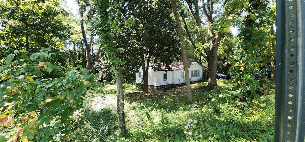 1926 Sumter Street Northwest Atlanta, GA 30318 - Photo 13 of 14 a view of a yard with large trees