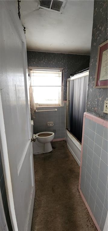 1926 Sumter Street Northwest Atlanta, GA 30318 - Photo 5 of 14 a bathroom with a toilet and a shower