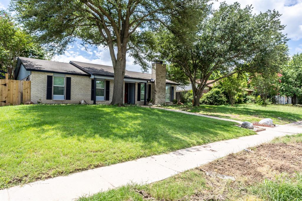 1206 Oakbluff Drive Lancaster, TX 75146 - Photo 2 of 23 Side view shows new side gate and landscaping rocks.