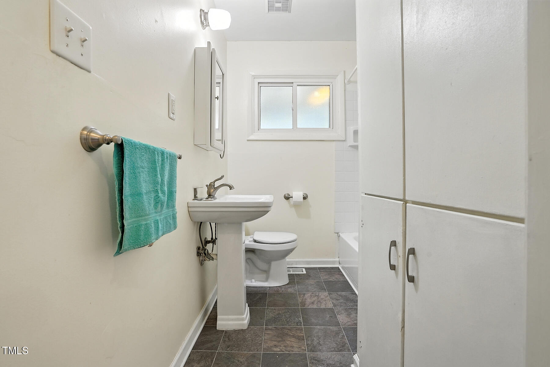 912 Dixie Trail Raleigh, NC 27607 - Photo 15 of 27 a bathroom with a sink toilet and shower