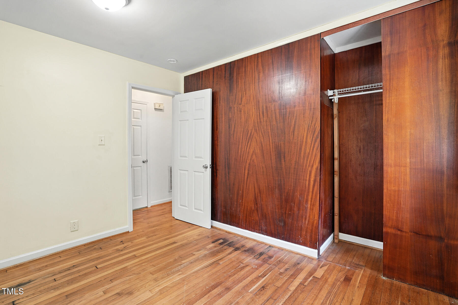 912 Dixie Trail Raleigh, NC 27607 - Photo 15 of 28 a view of an empty room with wooden floor